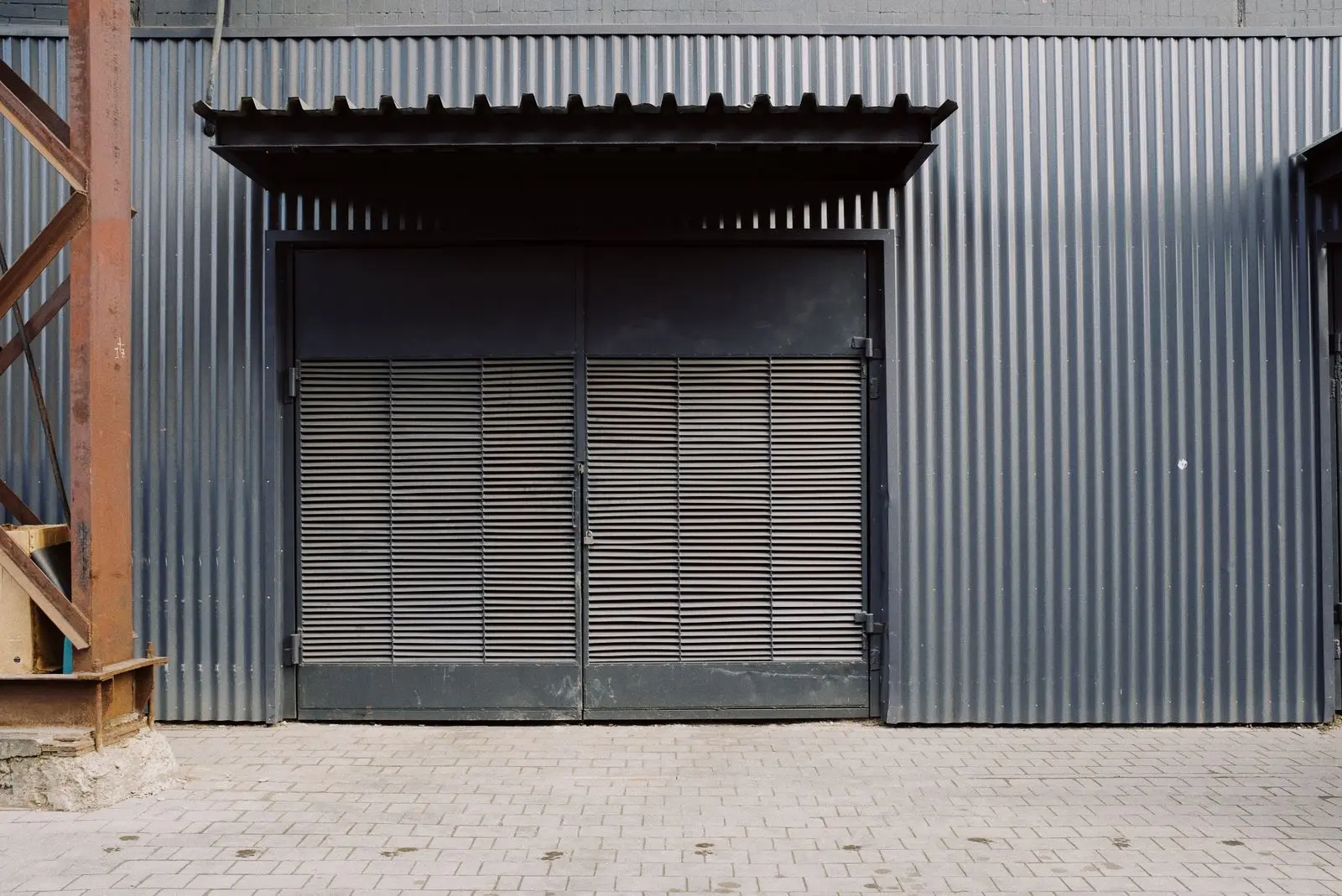 The door of the unit seen from the walkway outside