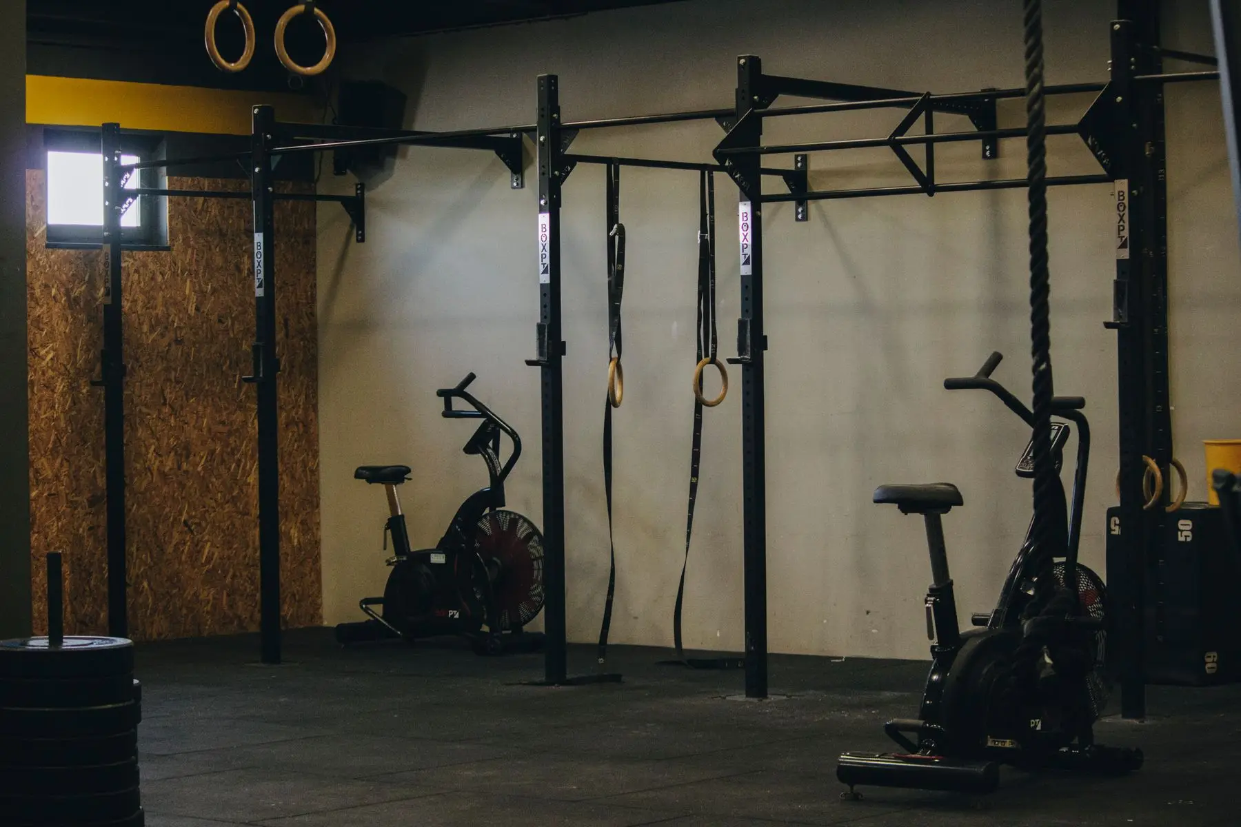 A wide view of the training floor, racks along one wall