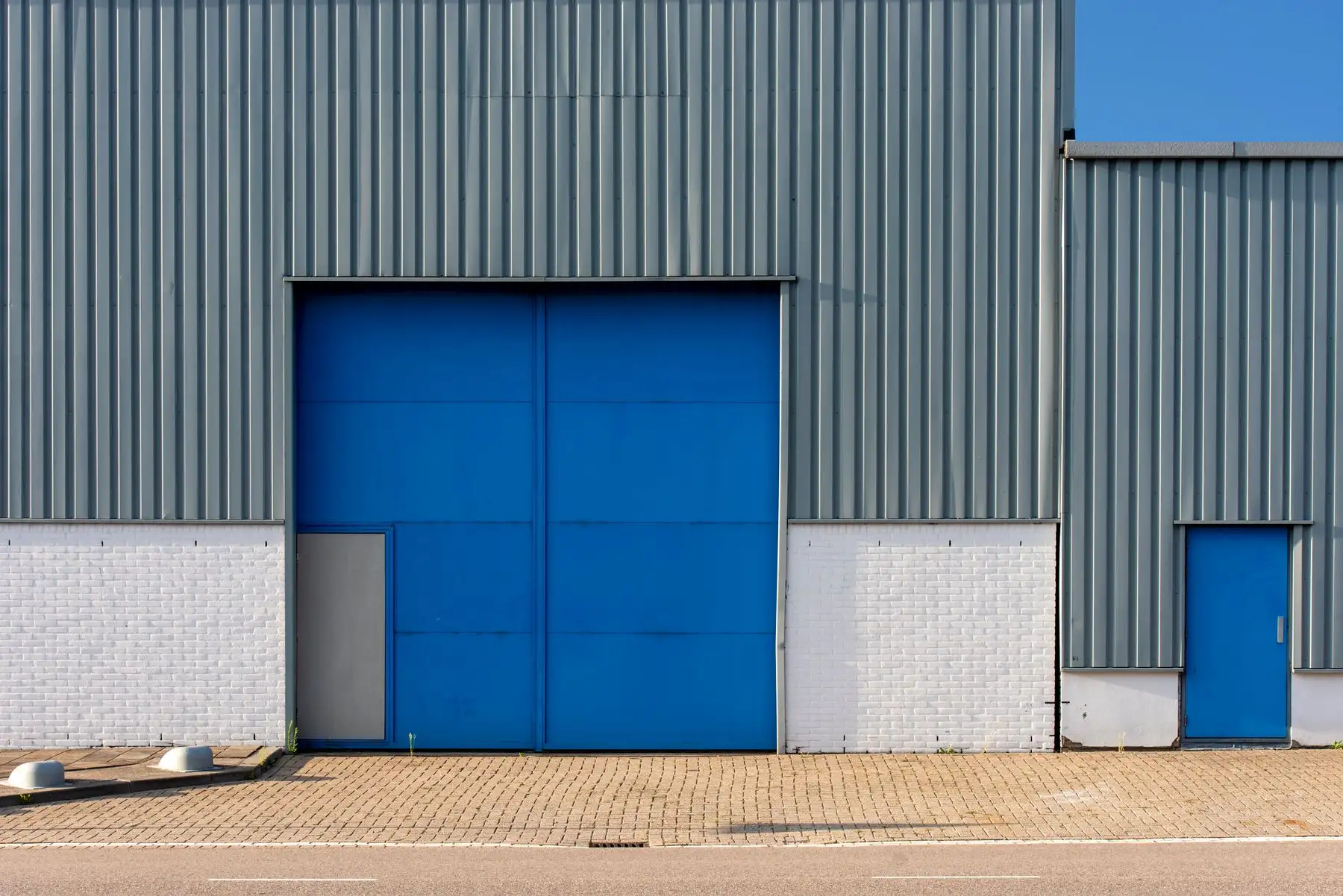 The front of the unit on Alma Street, with the parking bays outside