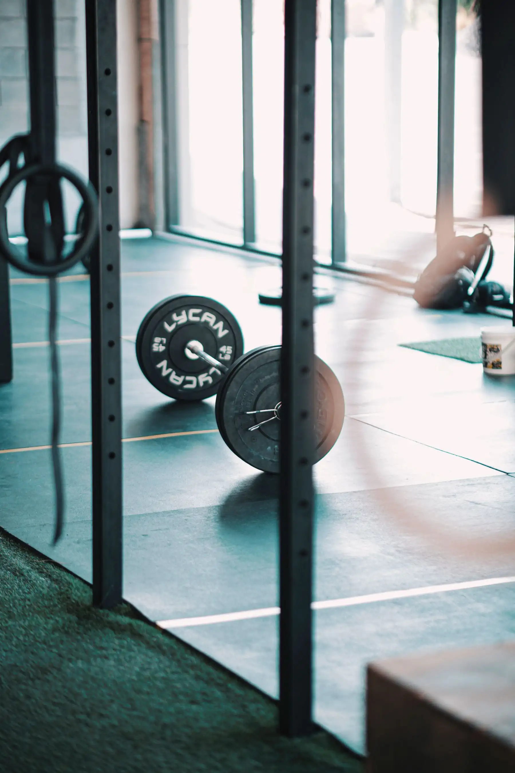 A barbell on the floor of the training room